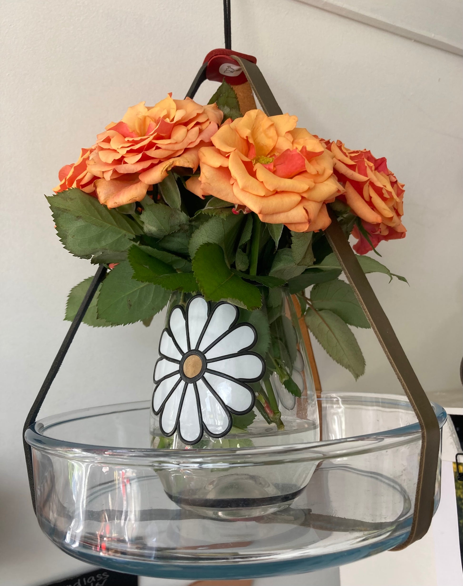 Wide glass plate with smaller vase and flowers suspended in pot hanger by craftybird