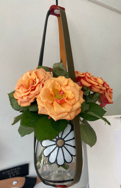 Vase of orange roses suspended in a vase by @caledoniaglass in pot holder by craftybird